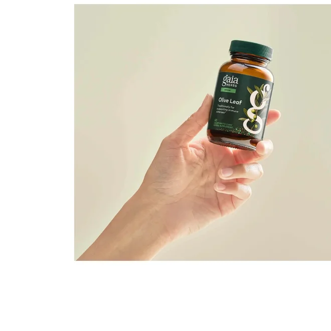 Gaia Herbs supplement bottle held in hand